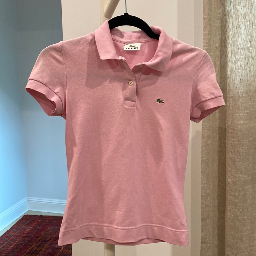 Lacoste pink polo. Size 36 (xs).  Lightly worn. no stains or damages